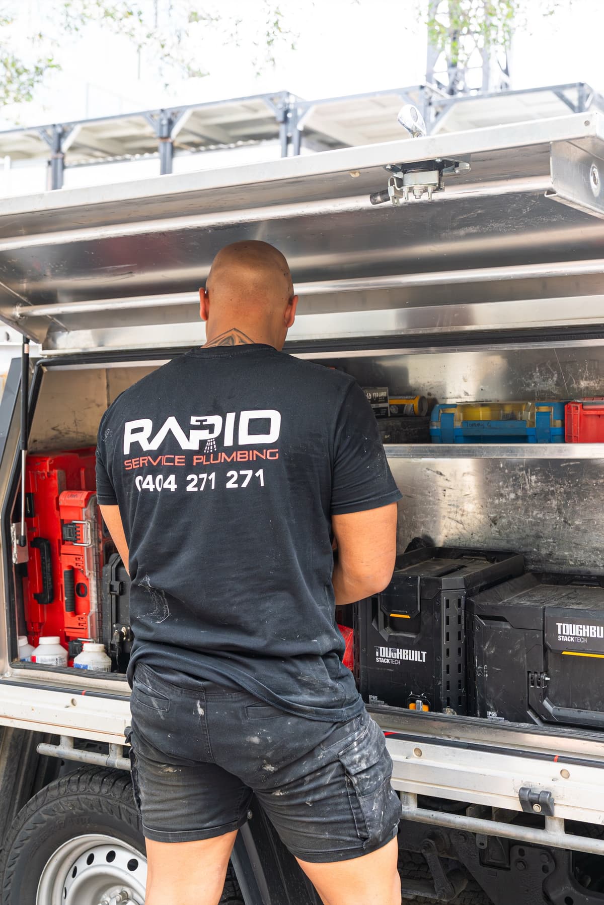 Plumber on-site with branded gear