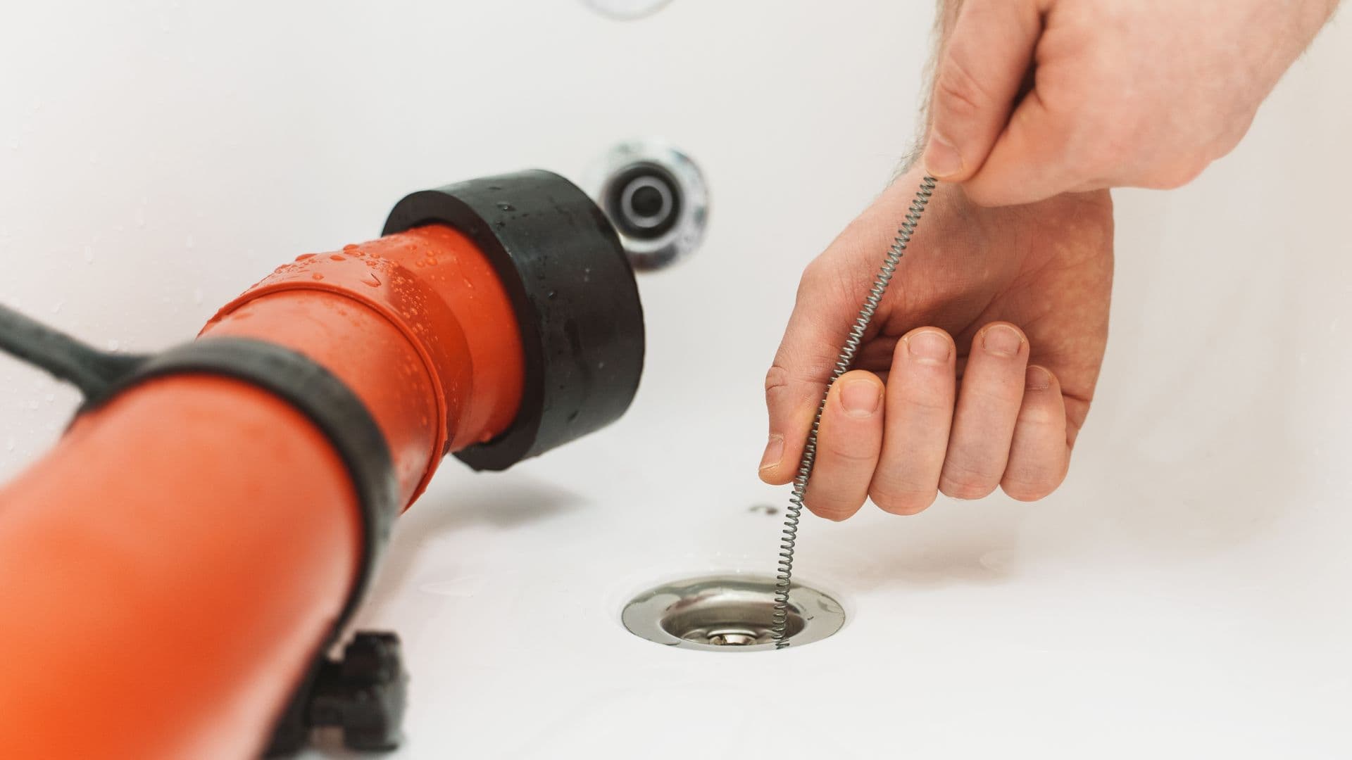 Plumber using a drain camera to inspect a blocked drain