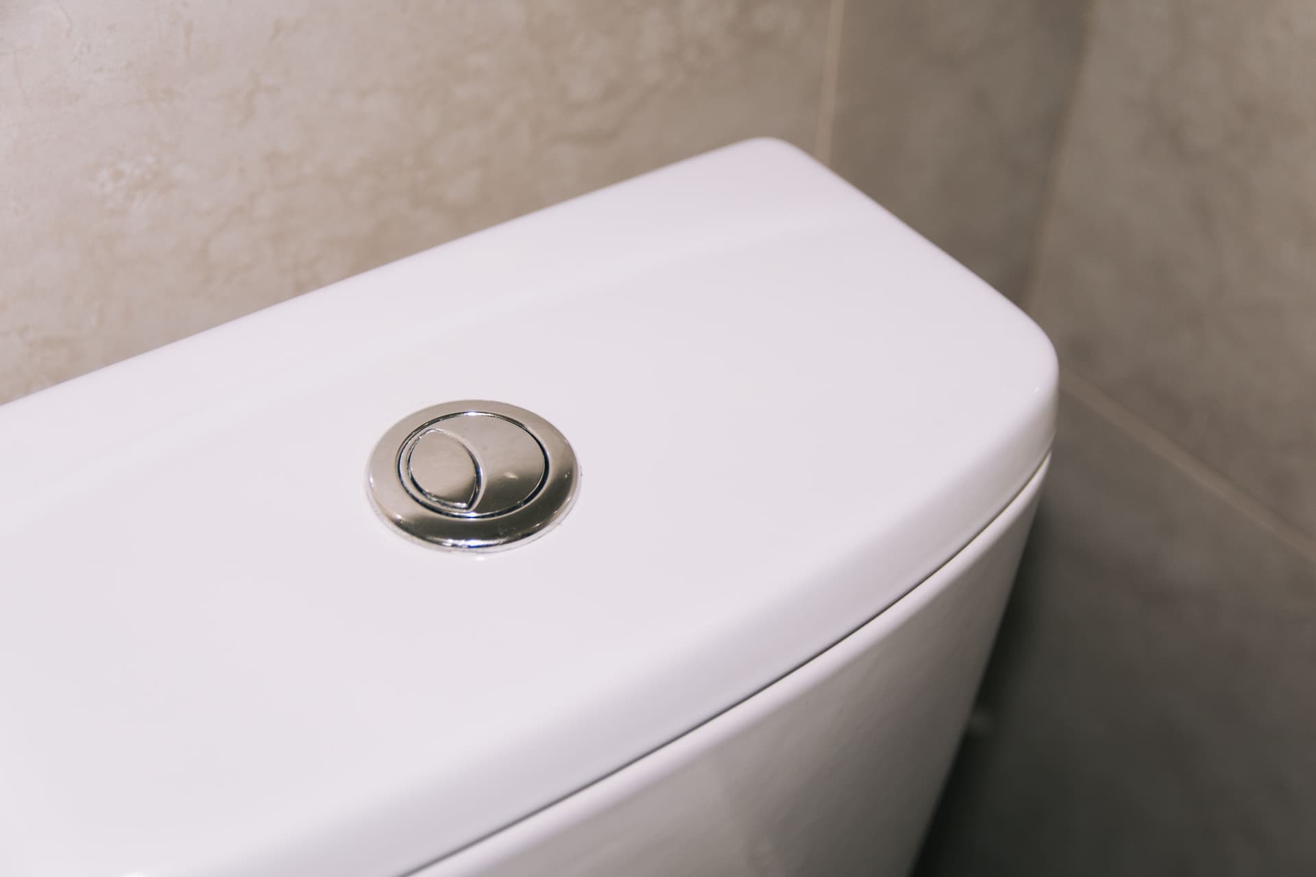 Open toilet cistern showing the flapper, fill valve and float mechanism
